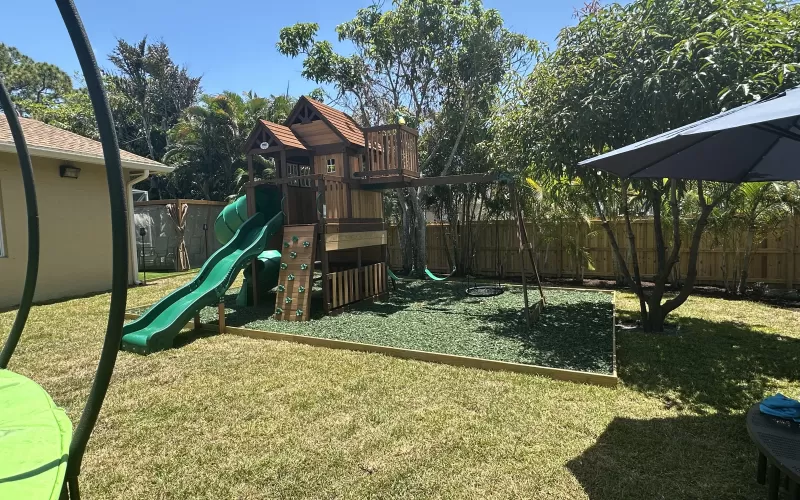 Playground surface with green rubber mulch