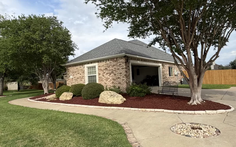 Red Rubber Mulch Landscaping in Front Yard