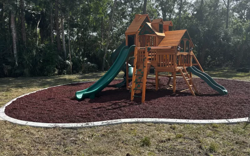 Playground with red rubber mulch