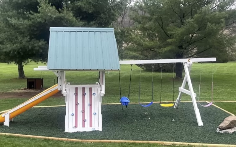 Playground with green rubber mulch ground cover