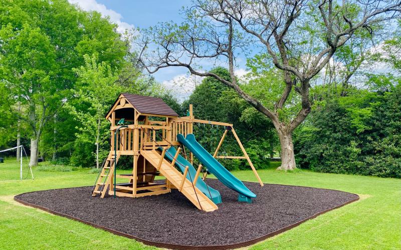 Playground with brown rubber mulch surfacing