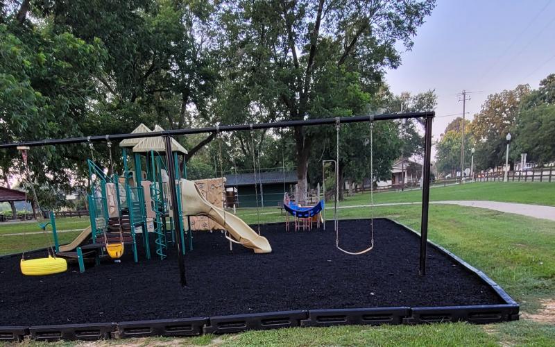 Playground with black rubber mulch ground cover