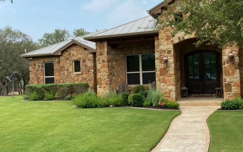 Rubber mulch in front yard garden beds