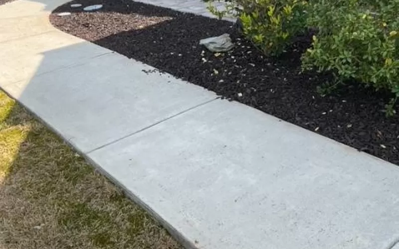 Brown Rubber Mulch in Entrance Garden Beds