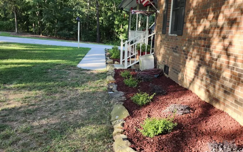 Red rubber mulch garden bed