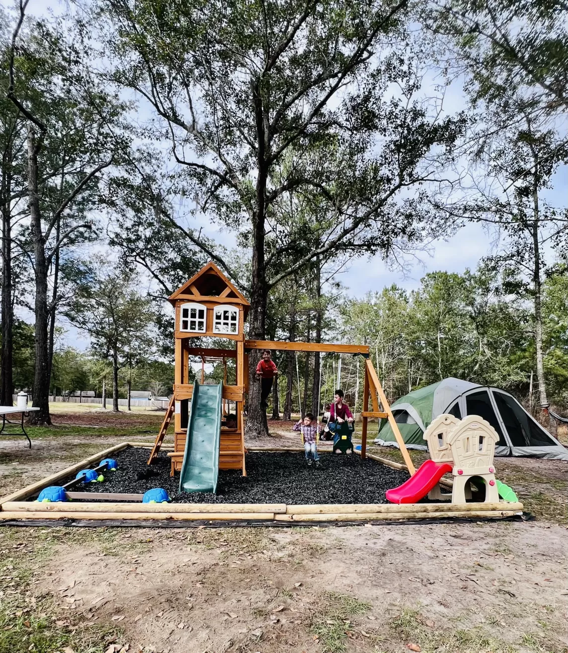 Playground with wood borders and uncoated rubber mulch