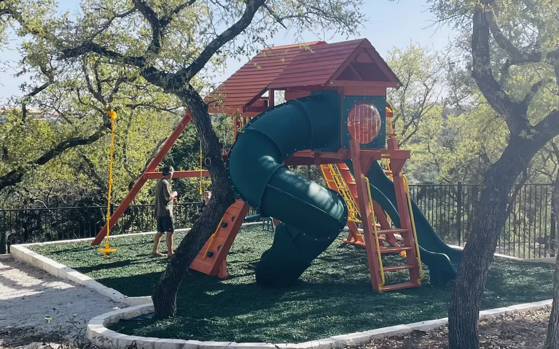 Playground with green rubber mulch surfacing