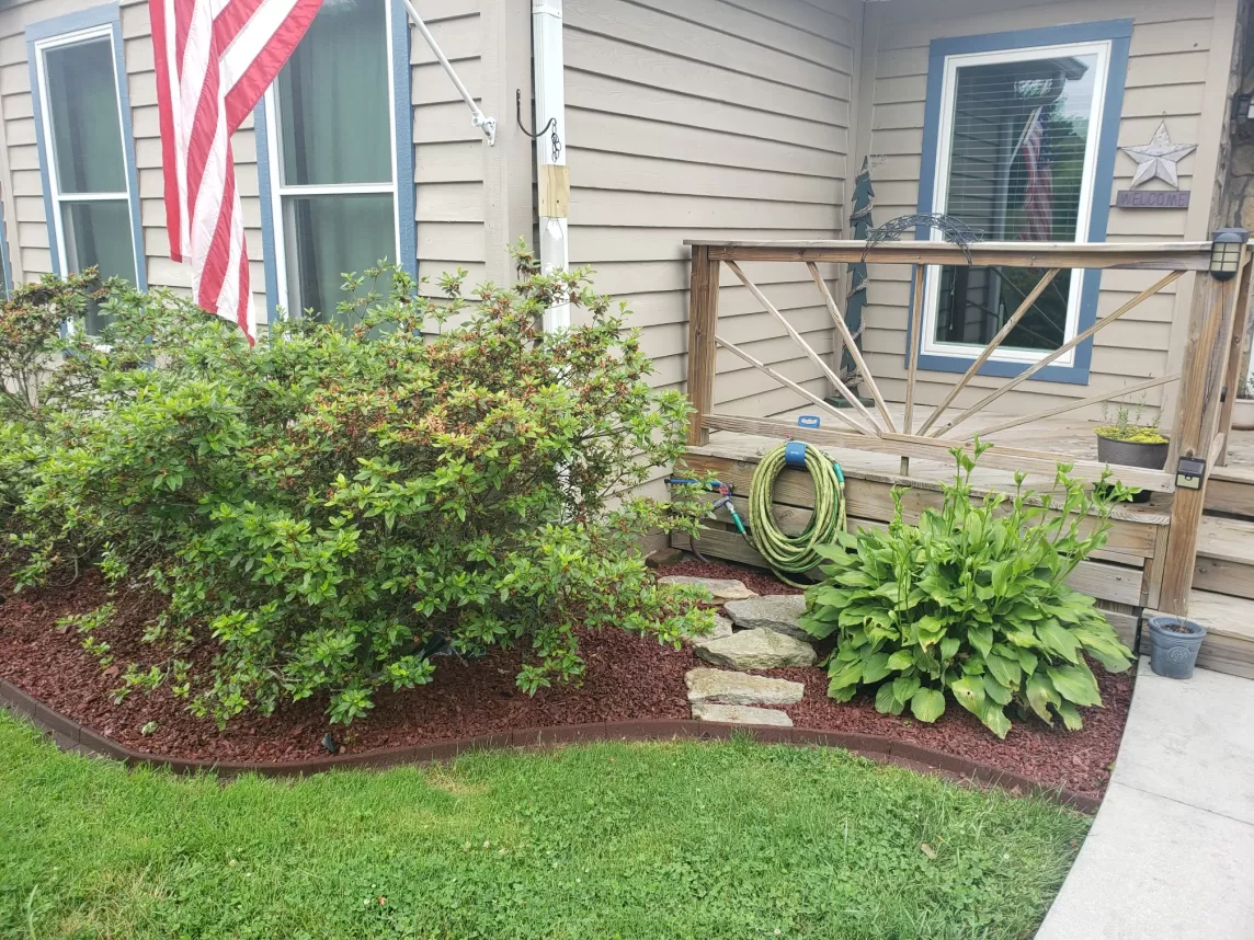 Red Rubber Mulch Garden Bed Front of House