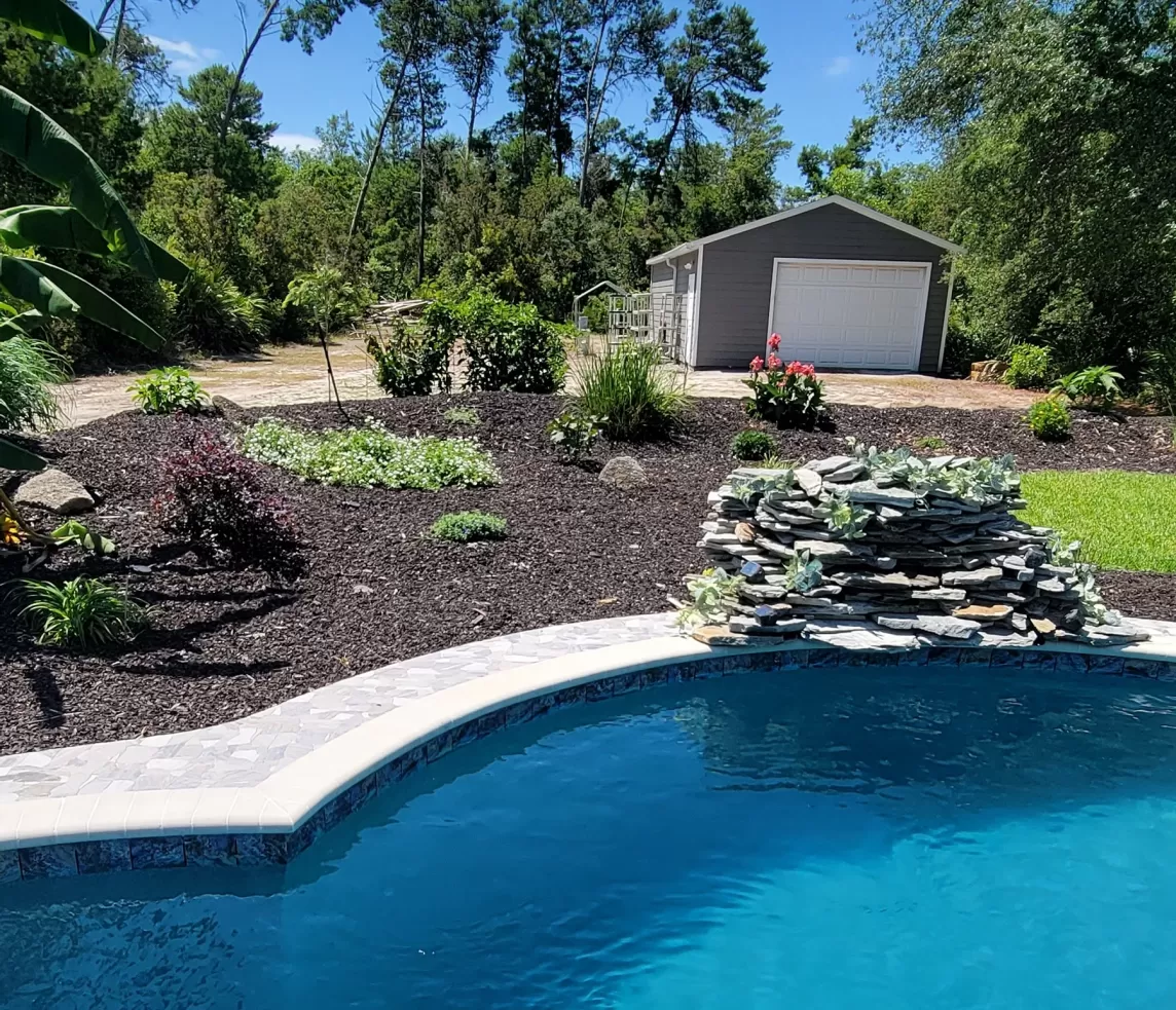 Brown rubber mulch in pool backdrop