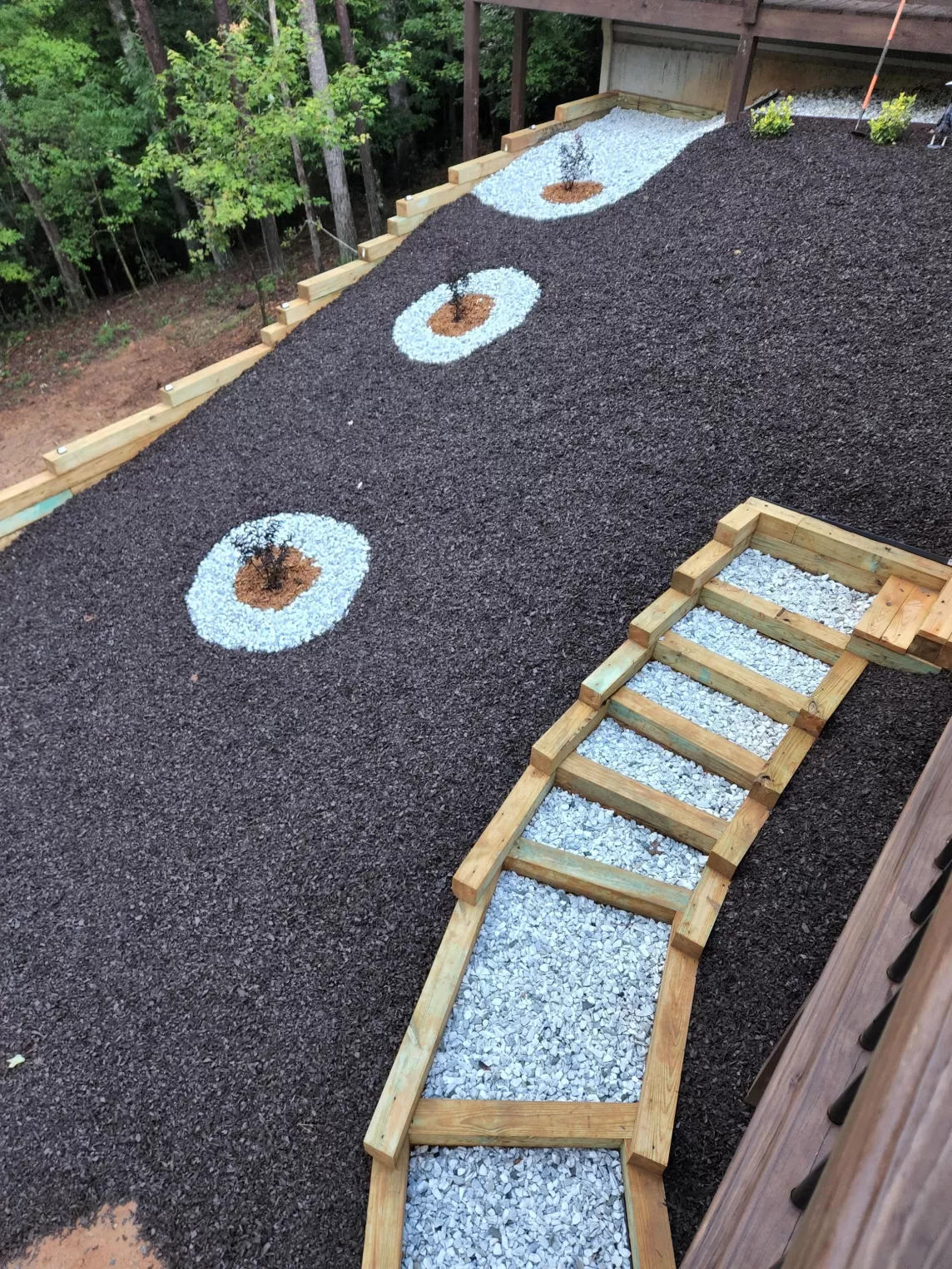Backyard Slope With Rubber Mulch Landscaping