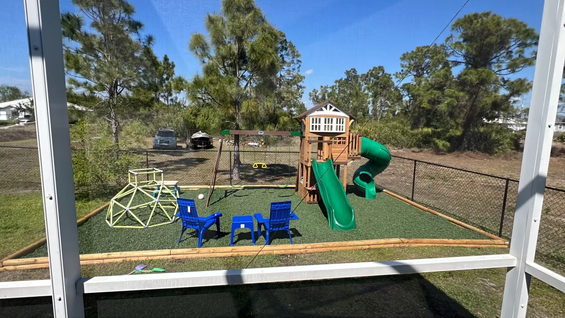 Playground with green rubber mulch ground cover