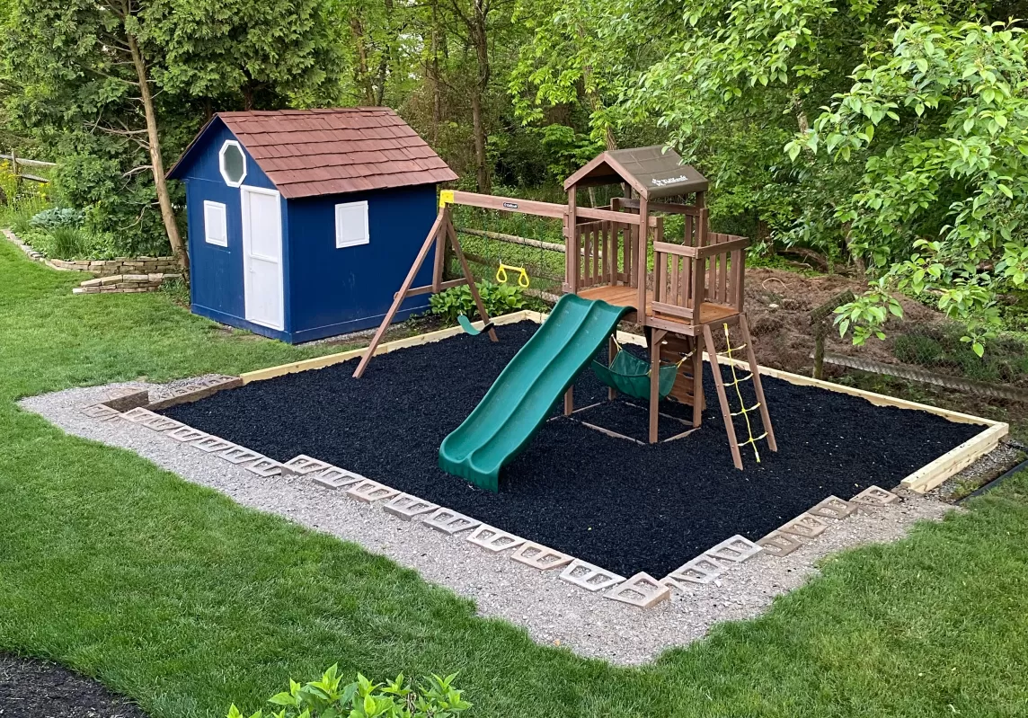 Playground with black rubber mulch surfacing