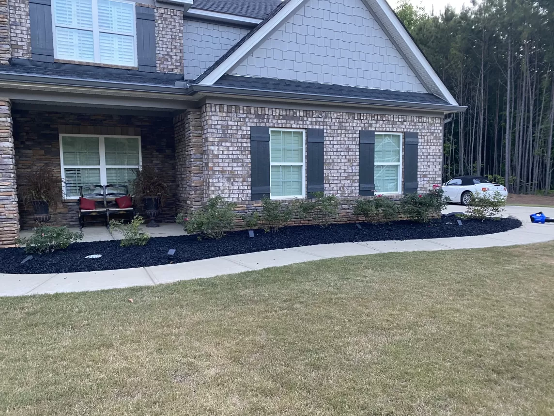Black Rubber Mulch Landscaping All the Way Around House
