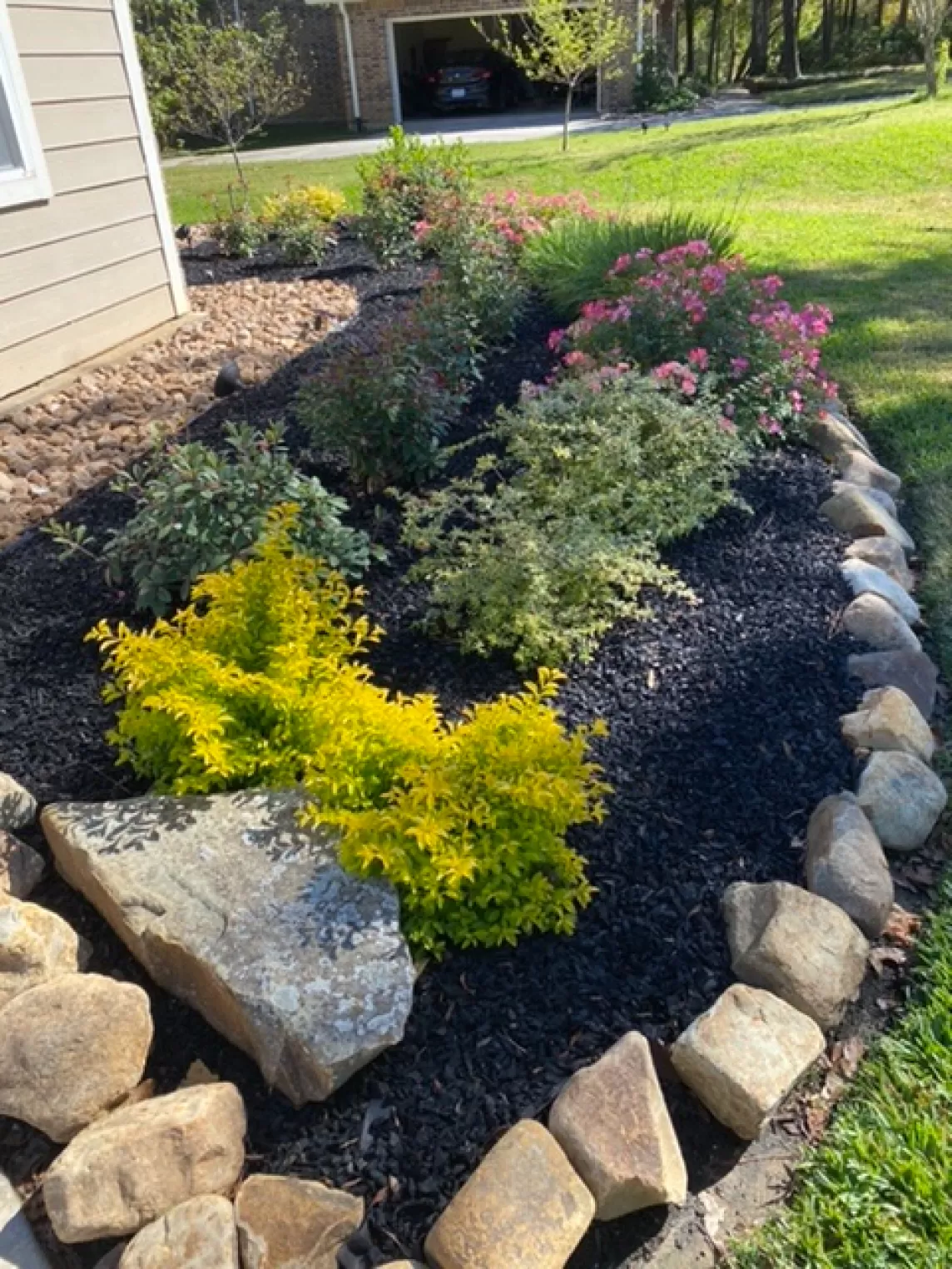 Rubber Mulch Landscaping with Stone Border Zone