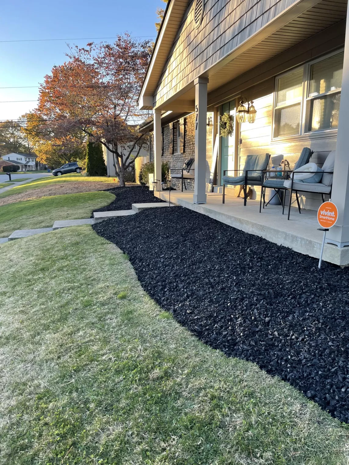 Black rubber mulch around new house