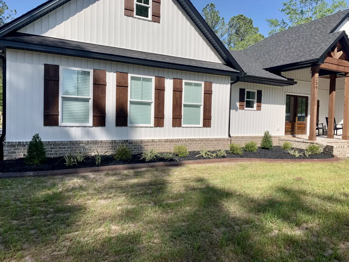 Front of house with black landscaping rubber mulch