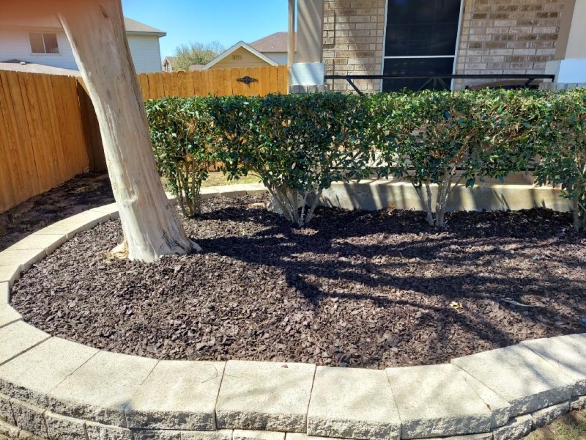 Brown Rubber Mulch Landscaping with Stone Edging
