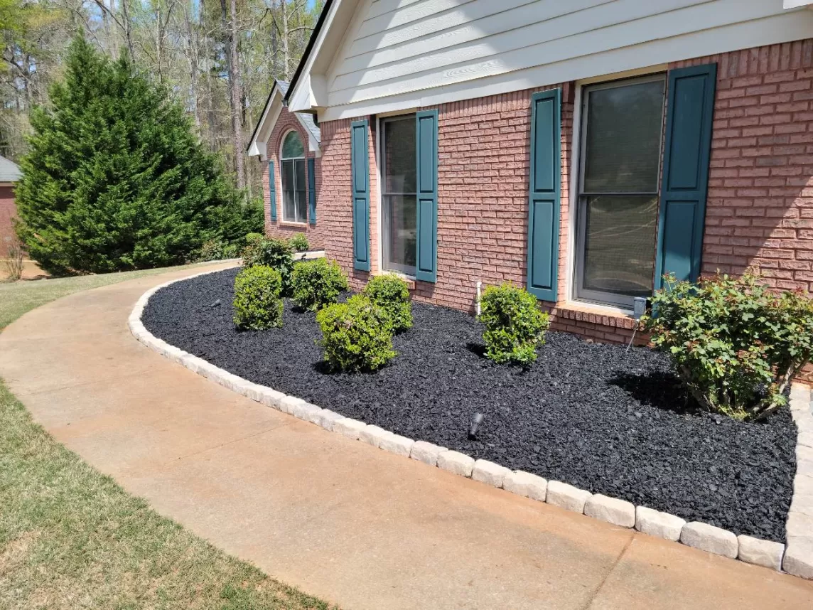 Front of house plant beds with rubber mulch