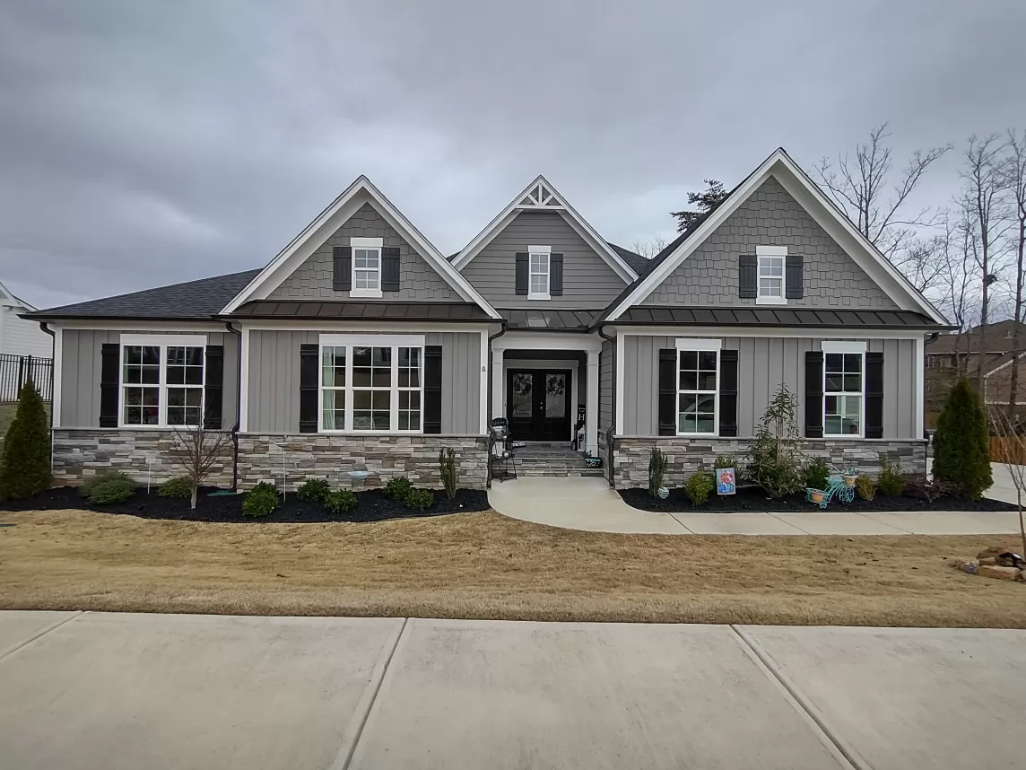 Rubber mulch landscaping in front of quaint home