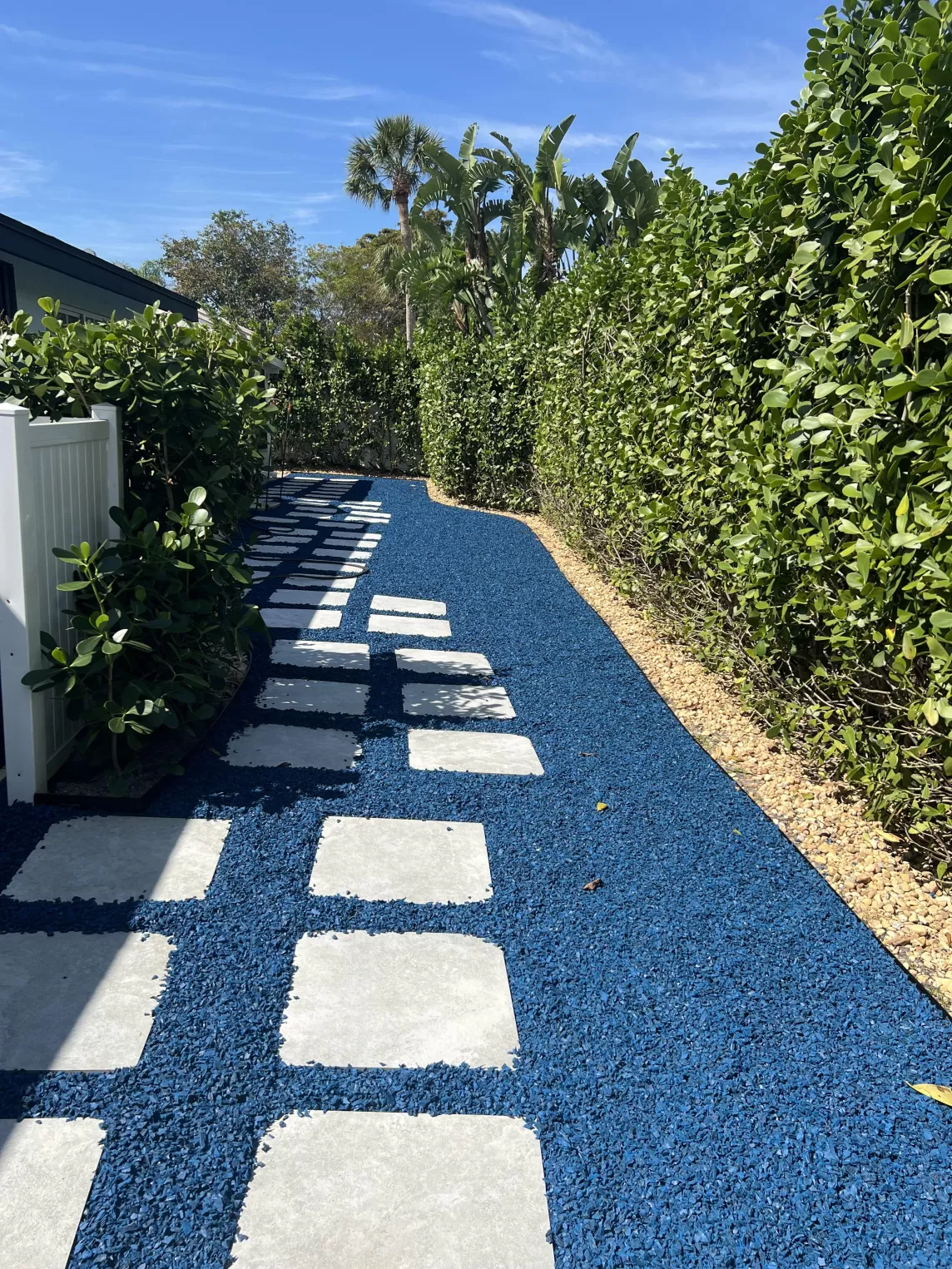 Long path with blue rubber mulch