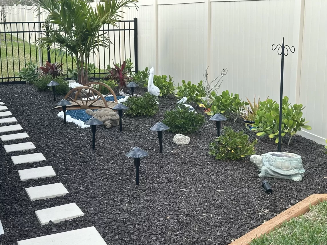 Brown Rubber Mulch in Backyard Landscaping