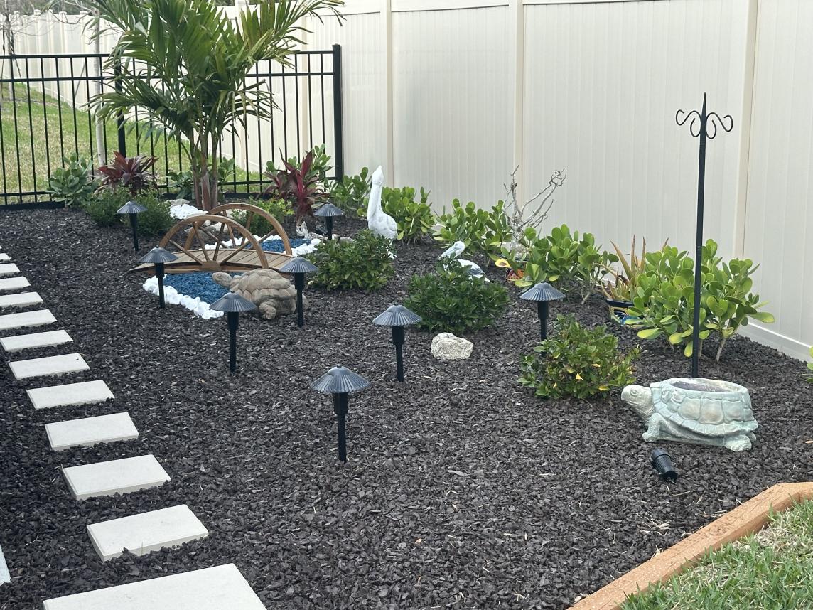 Brown Rubber Mulch in Backyard Landscaping