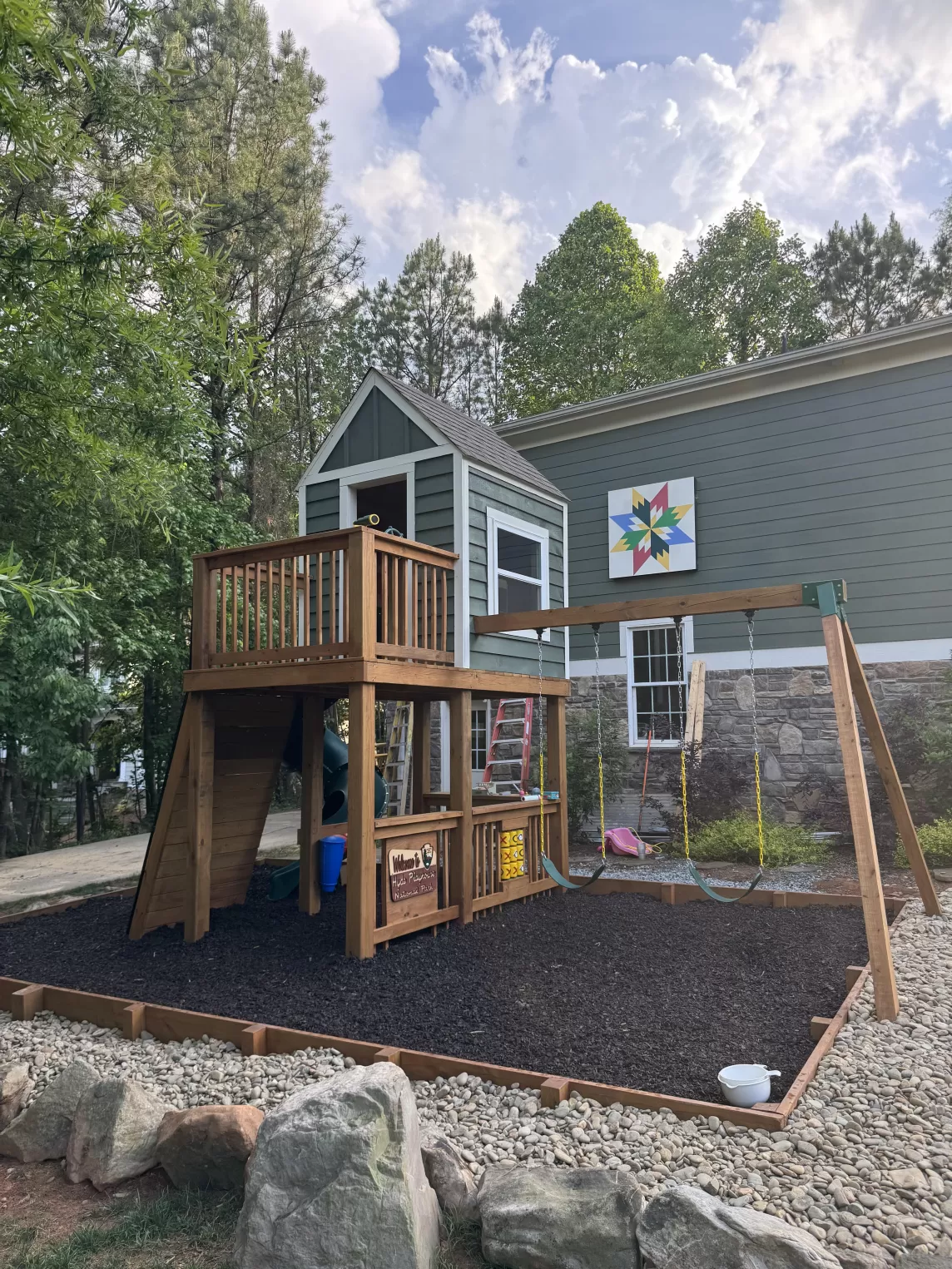 Playground with brown rubber mulch ground cover