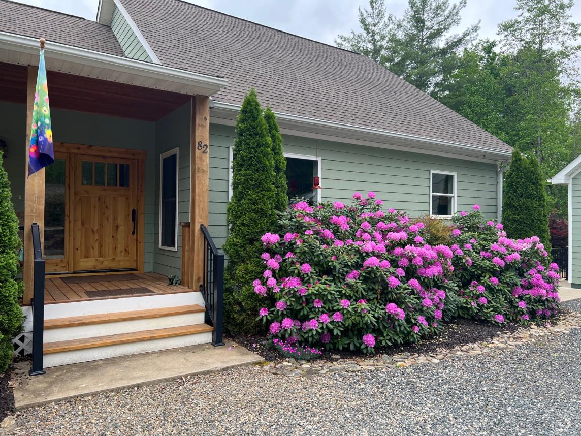 Brown rubber mulch in the front yard landscape beds