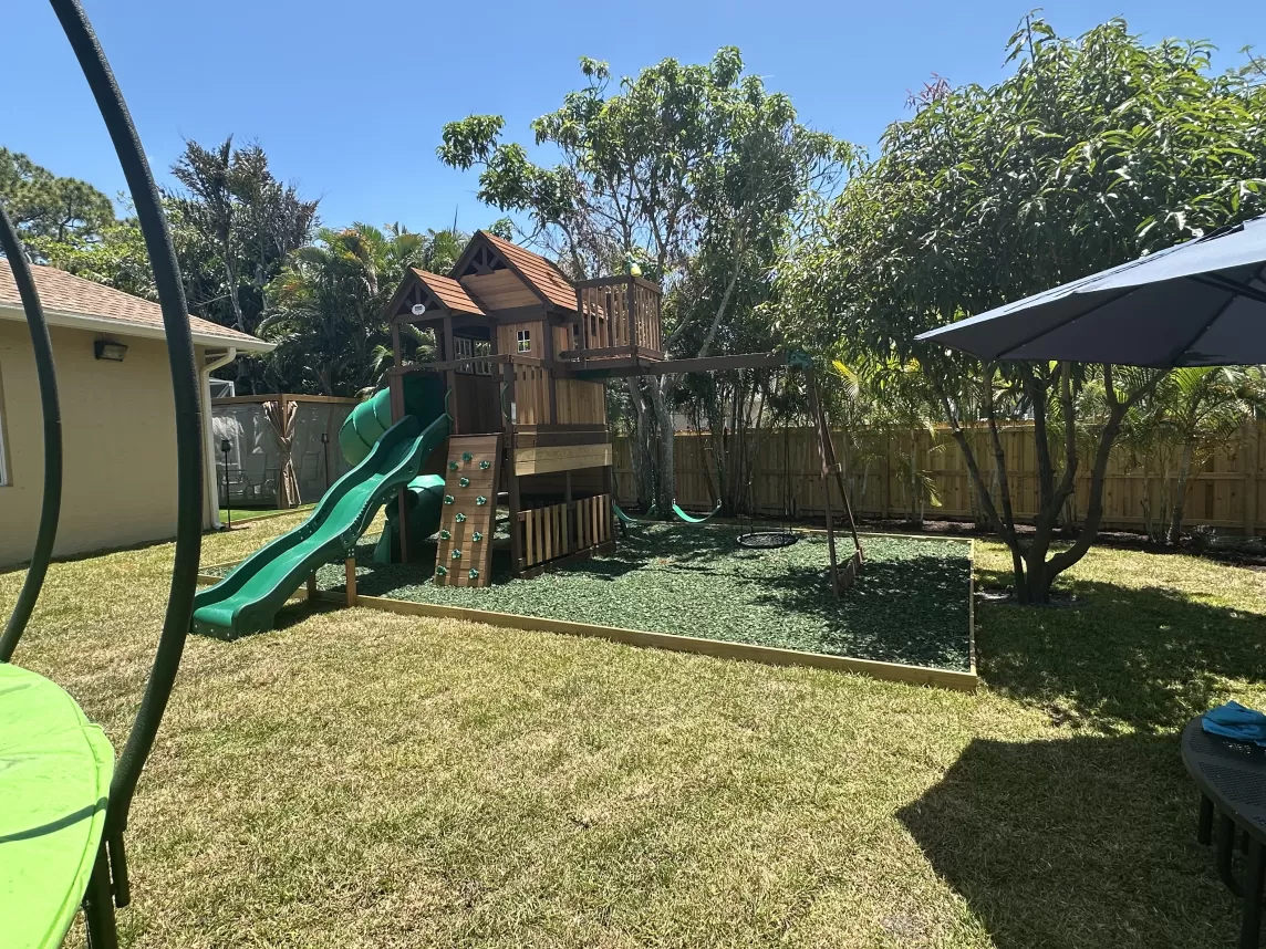 Playground surface with green rubber mulch