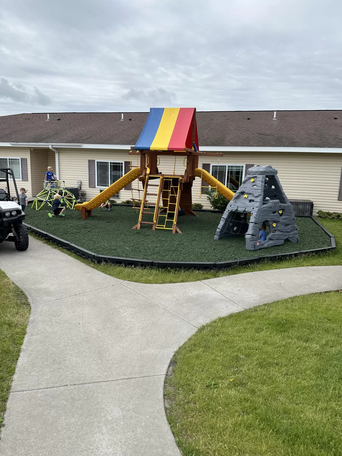 Playground with green rubber mulch and duratimber borders