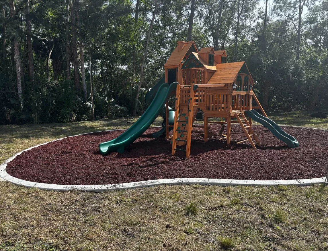 Playground with red rubber mulch