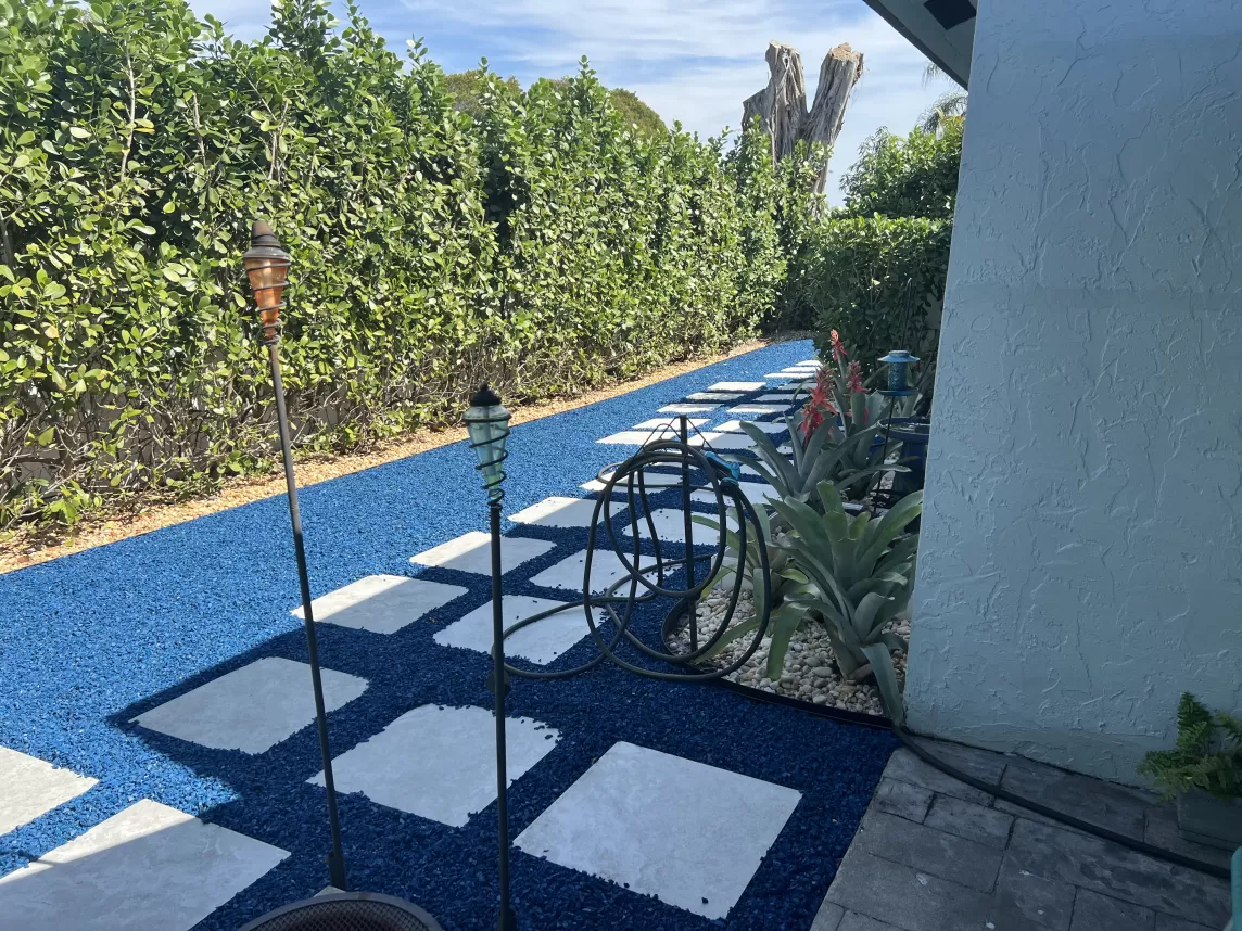 Stone paver path with blue rubber mulch surround