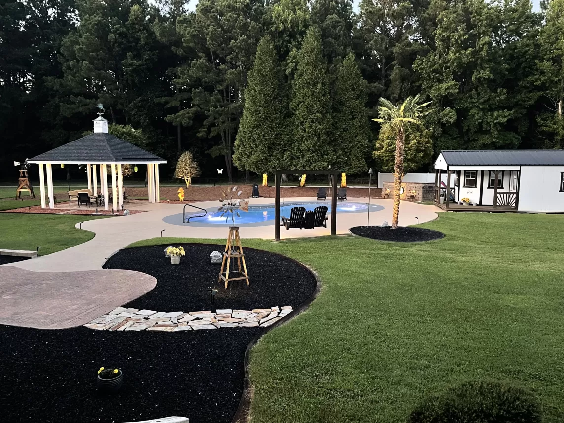 Black Rubber Mulch Backyard Landscaping After Photo