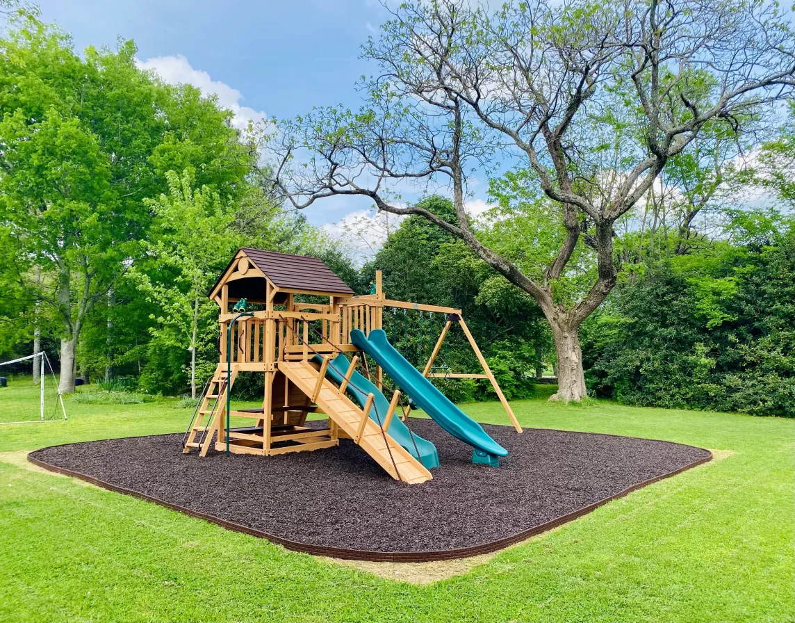 Playground with brown rubber mulch surfacing