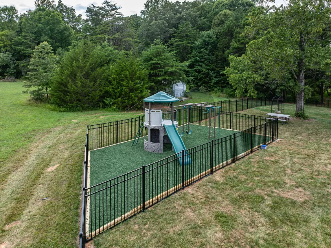 Play area with green rubber mulch surfacing