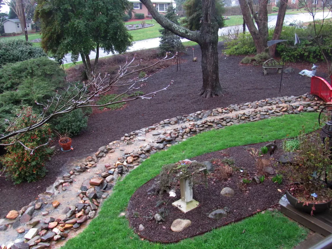 Brown Rubber Mulch Landscaping With a Creek