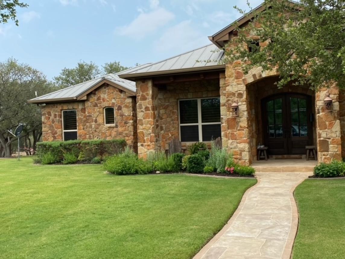 Rubber mulch in front yard garden beds