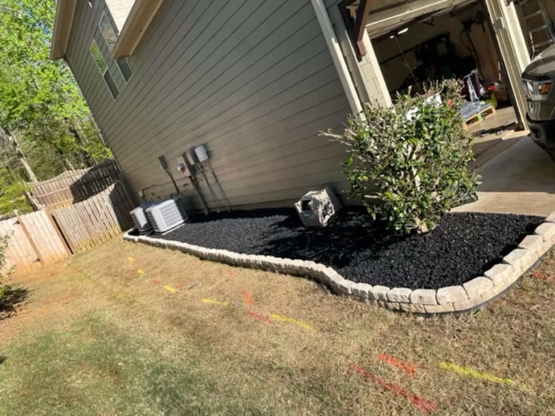 Black rubber mulch side yard landscaping