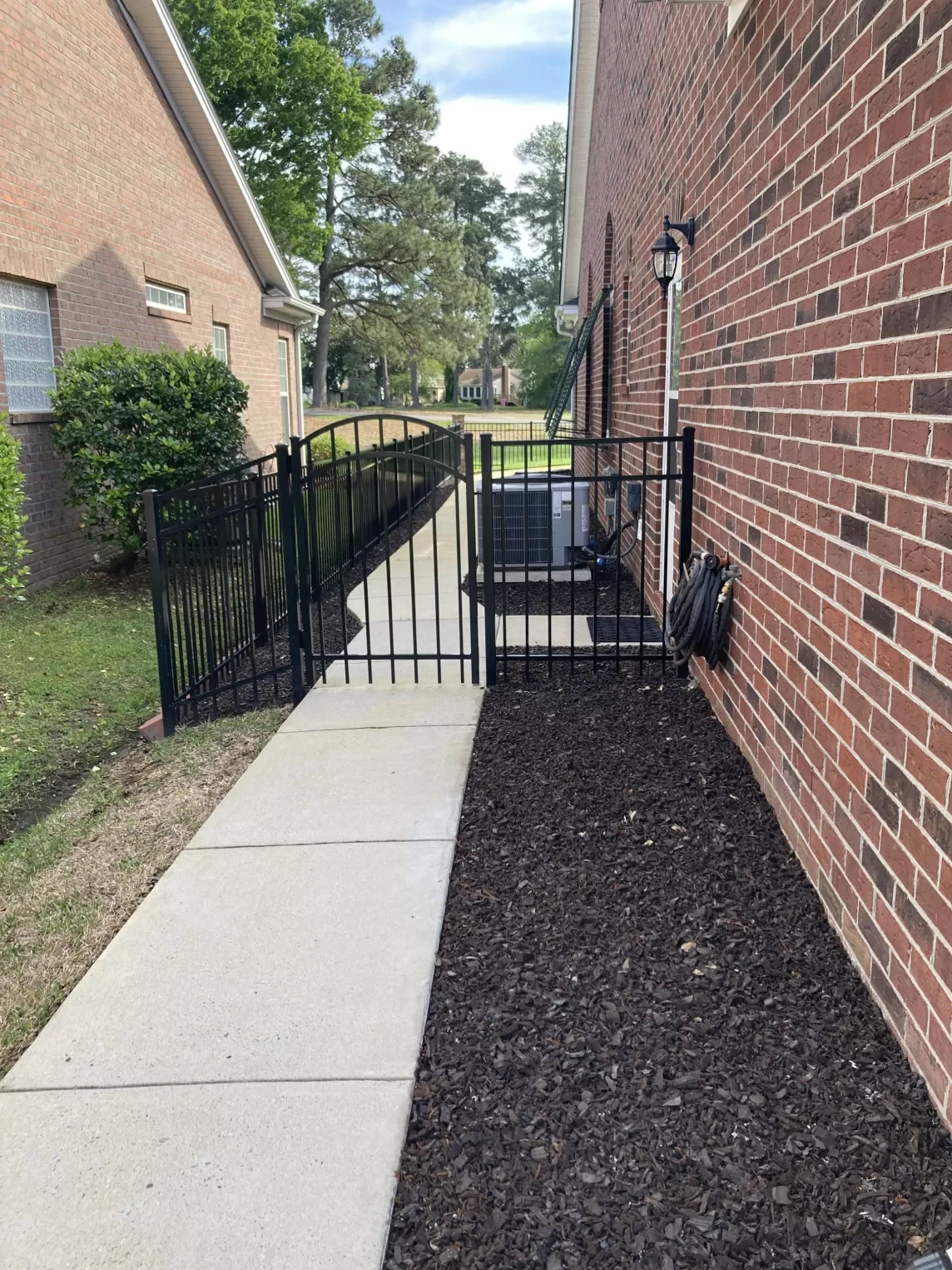 Rubber mulch in side yard next to house
