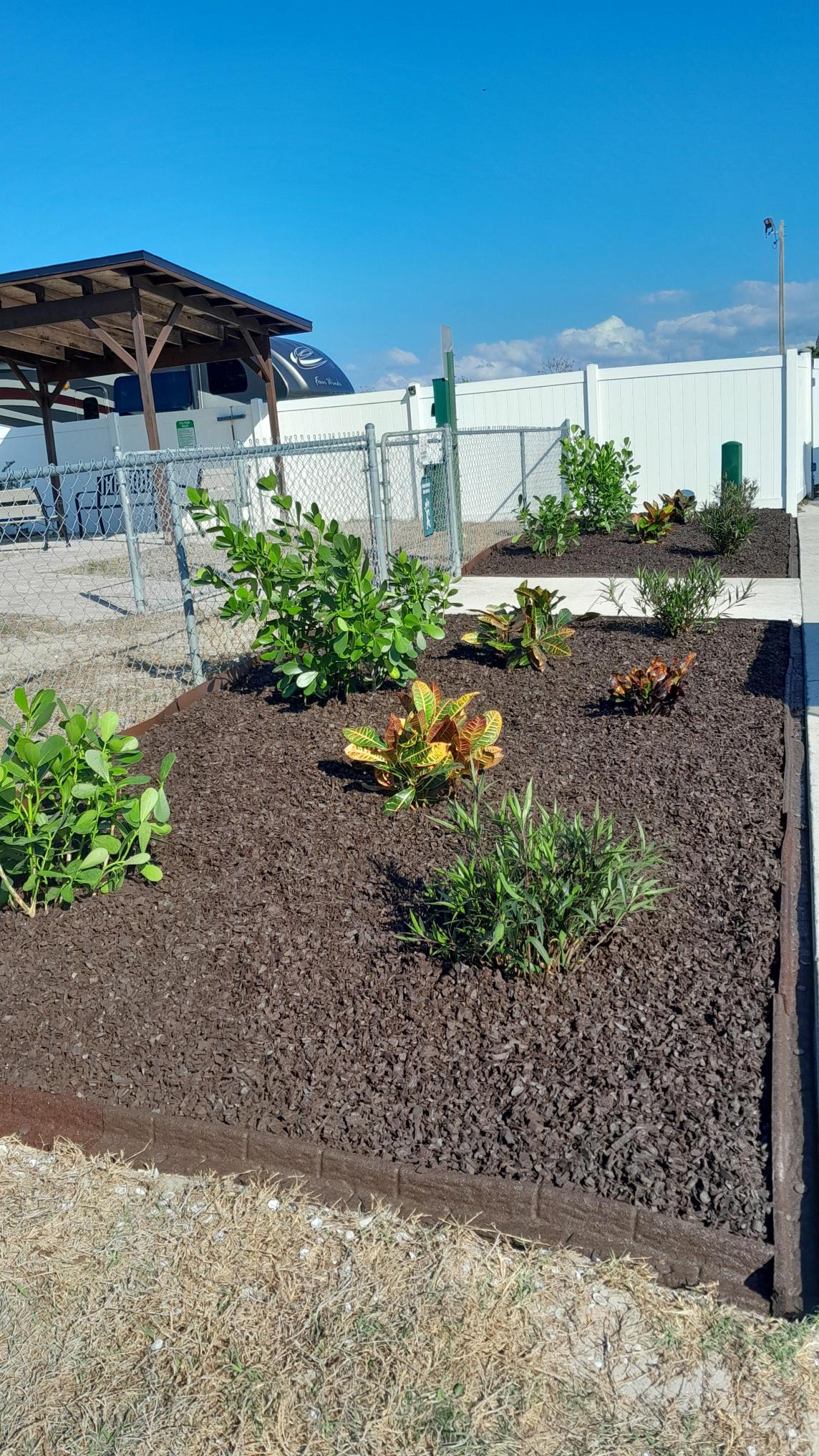 Dog park with rubber mulch landscaping