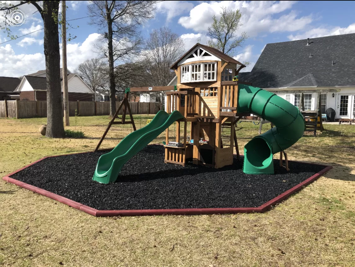 Playground with rubber mulch and hexagon border